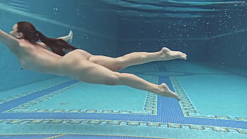 Hungarian babe Sazan Cheharda swims and strips in the pool