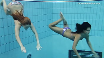 Lesbians Silvie and Zhanetta swimming underwater