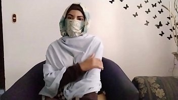 Praying Arab in hijab squirting her pussy on webcam
